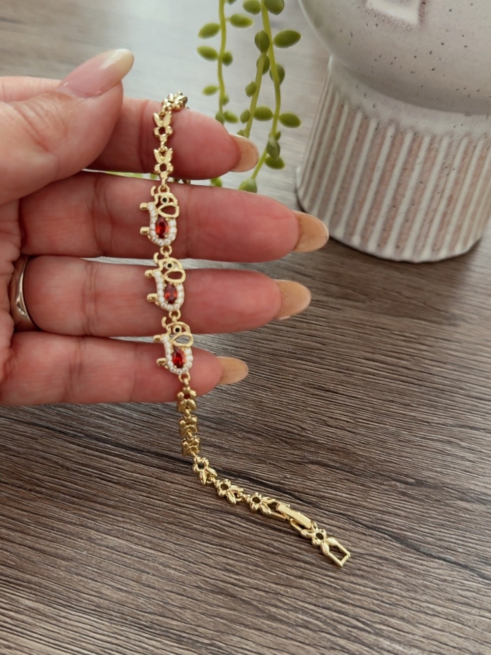 Gold Elephant Charm Bracelet with Red Accent